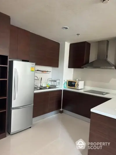 Modern kitchen with sleek cabinetry and stainless steel appliances