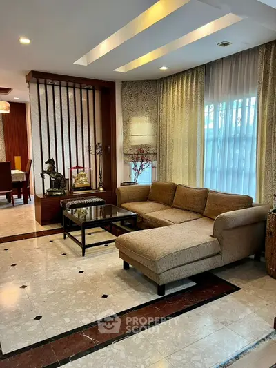 Elegant living room with modern decor and spacious seating area