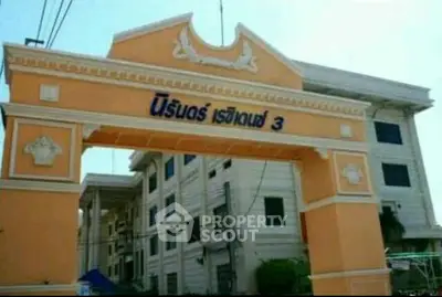 Elegant residential building entrance with classic architectural design and vibrant colors.