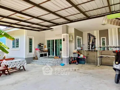 Charming home exterior with covered patio and modern design, perfect for outdoor relaxation.