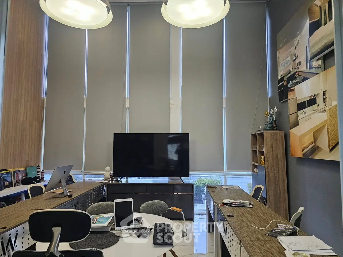 Modern office space with sleek furniture and large windows