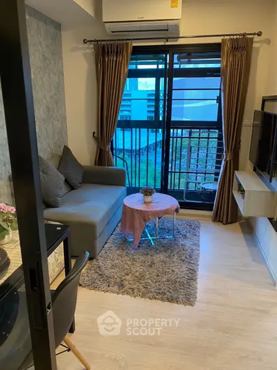 Cozy living room with modern decor and balcony view in urban apartment