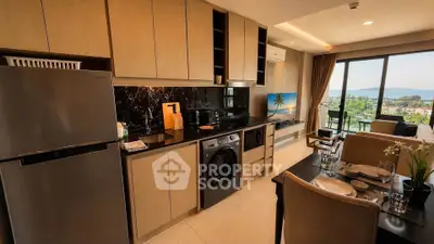 Modern kitchen with open layout and stunning sea view from balcony