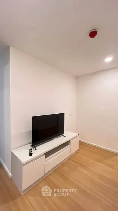 Modern living room with sleek TV stand and minimalist decor