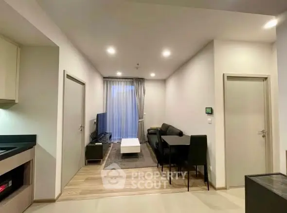 Modern living room with sleek furniture and open layout, perfect for urban living.