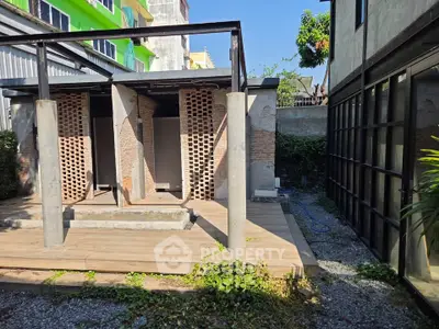 Modern industrial-style exterior with brick and glass elements, perfect for urban living.