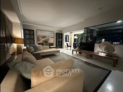 Luxurious modern living room with elegant decor and ambient lighting