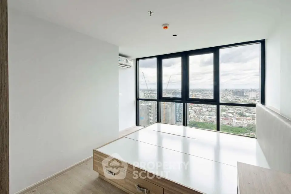 Modern bedroom with panoramic city view and built-in storage bed