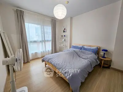 Cozy bedroom with modern decor and natural light