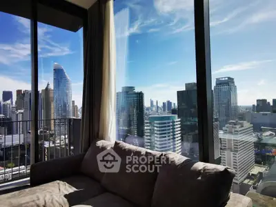 Luxurious living room with stunning city skyline view from high-rise apartment.