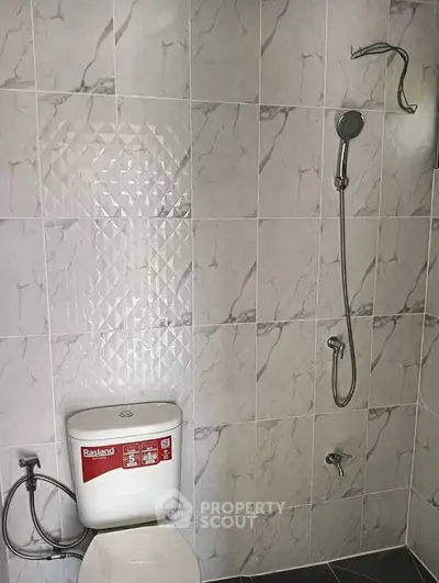 Modern bathroom with sleek shower and tiled walls