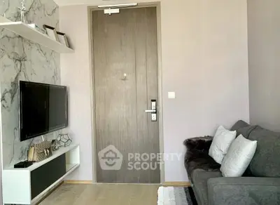 Modern living room with stylish decor and wall-mounted TV
