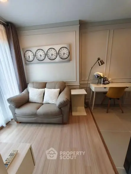 Cozy living room with stylish decor and a compact study area