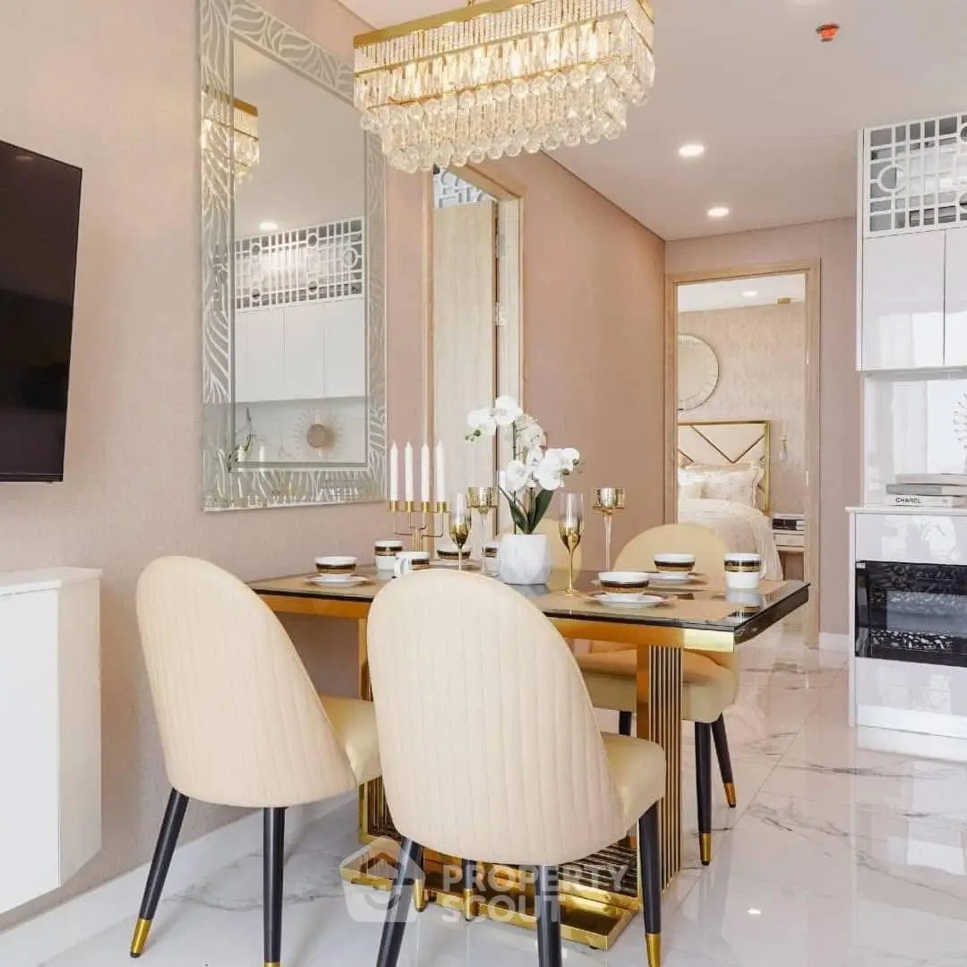 Elegant dining area with chandelier and modern decor in luxury apartment.