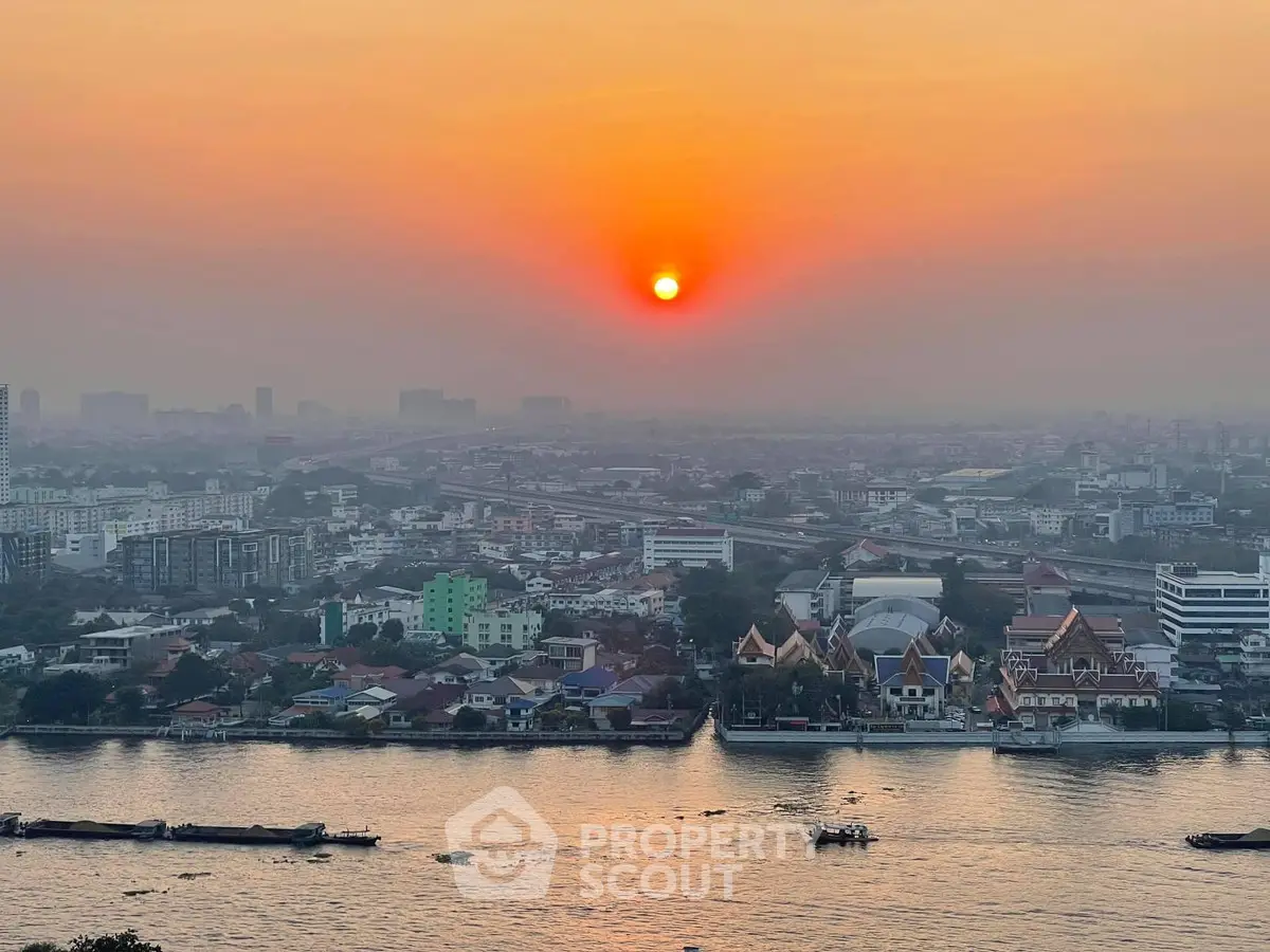 Stunning cityscape view at sunset over a serene river, perfect for urban living.
