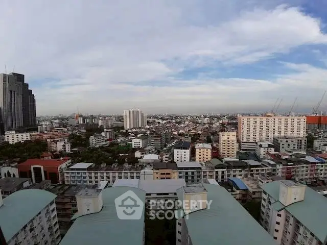 Stunning cityscape view from high-rise building showcasing urban skyline and residential architecture.