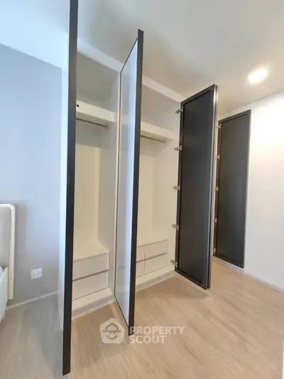 Spacious modern wardrobe with sleek design in a bright bedroom
