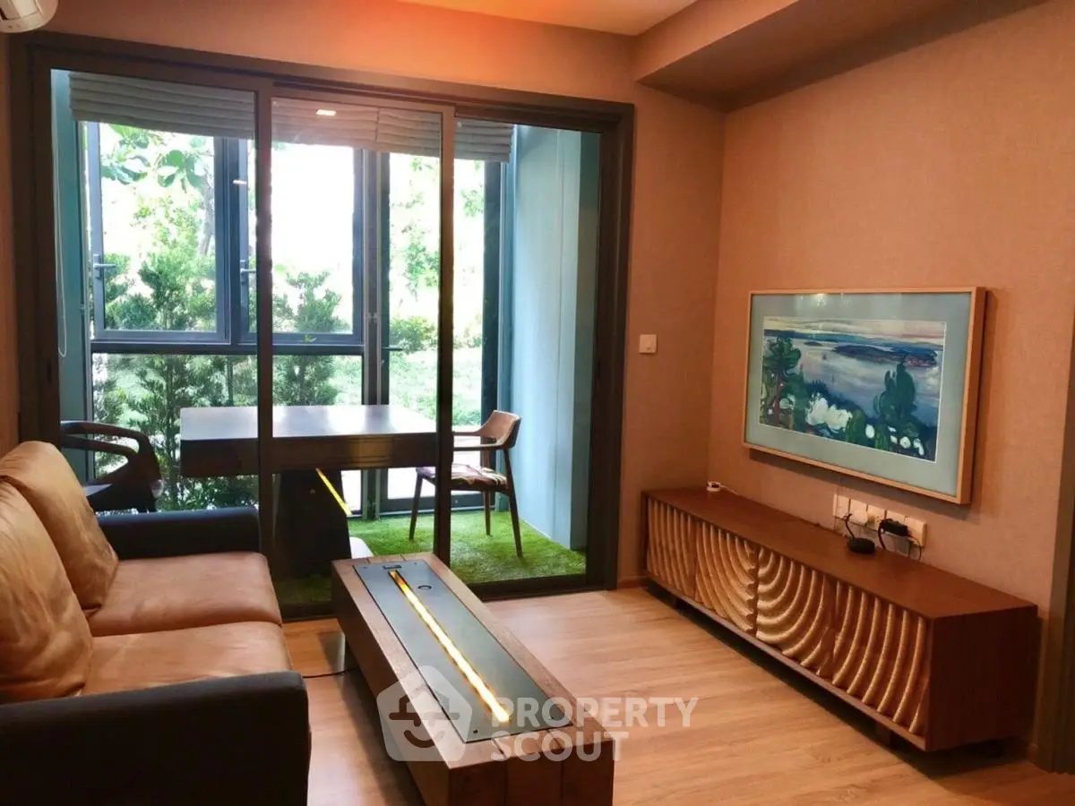 Modern living room with stylish furniture and balcony view