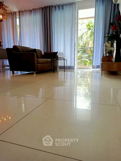 Spacious living room with elegant decor and garden view