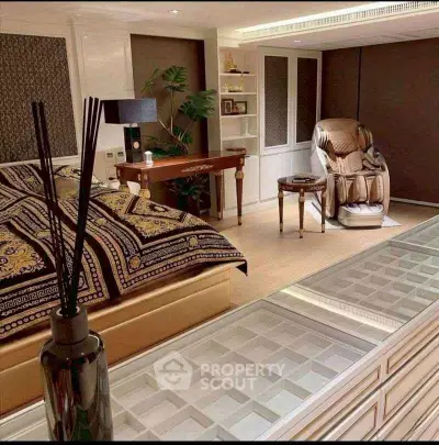 Luxurious bedroom with massage chair and elegant decor