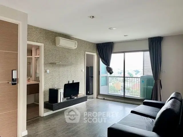 Modern living room with balcony view and sleek furnishings