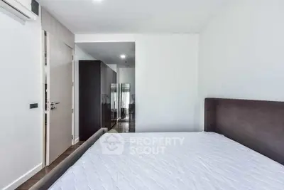 Modern bedroom with sleek design and ample natural light