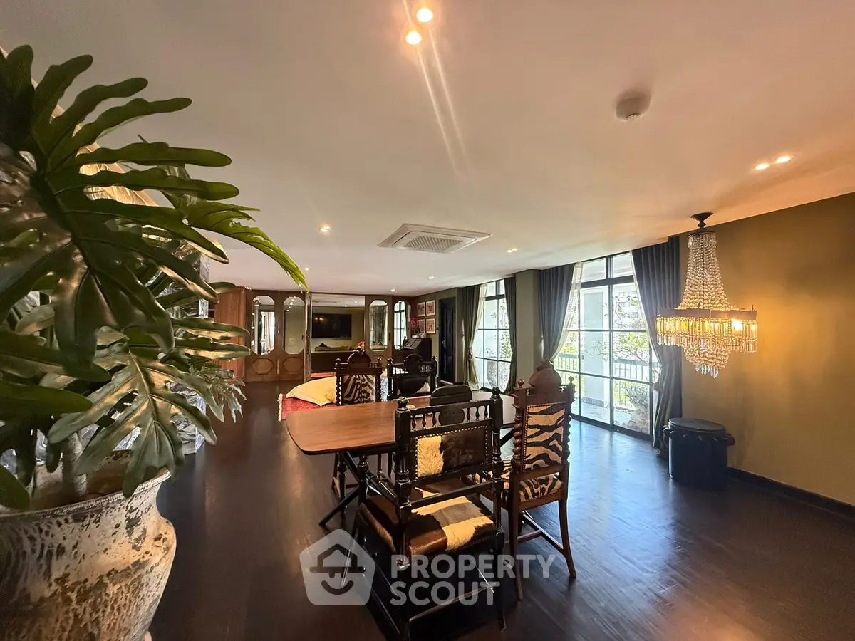 Luxurious living room with elegant decor and large windows offering natural light.