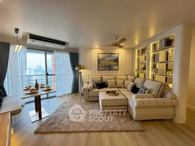Luxurious living room with elegant decor and city view, featuring a spacious sofa and stylish dining area.