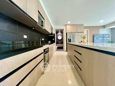 Modern kitchen with sleek cabinetry and island in contemporary home