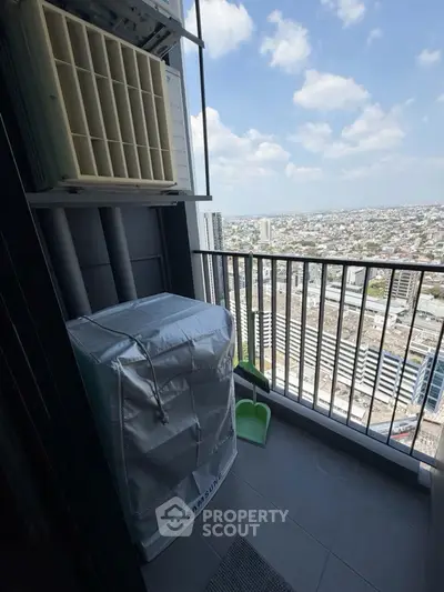 High-rise balcony with city view and air conditioning unit, perfect for urban living.
