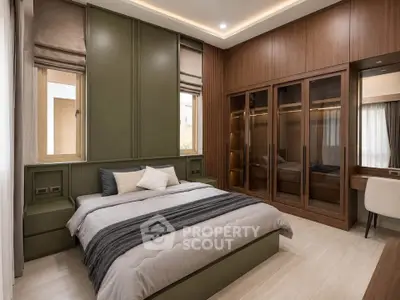 Luxurious bedroom with modern design, featuring elegant wood paneling and ample natural light.