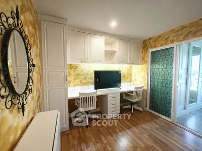 Chic study room with elegant decor and ample storage in modern apartment