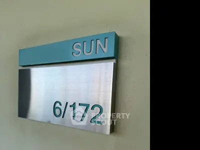 Modern apartment unit number sign with stylish design