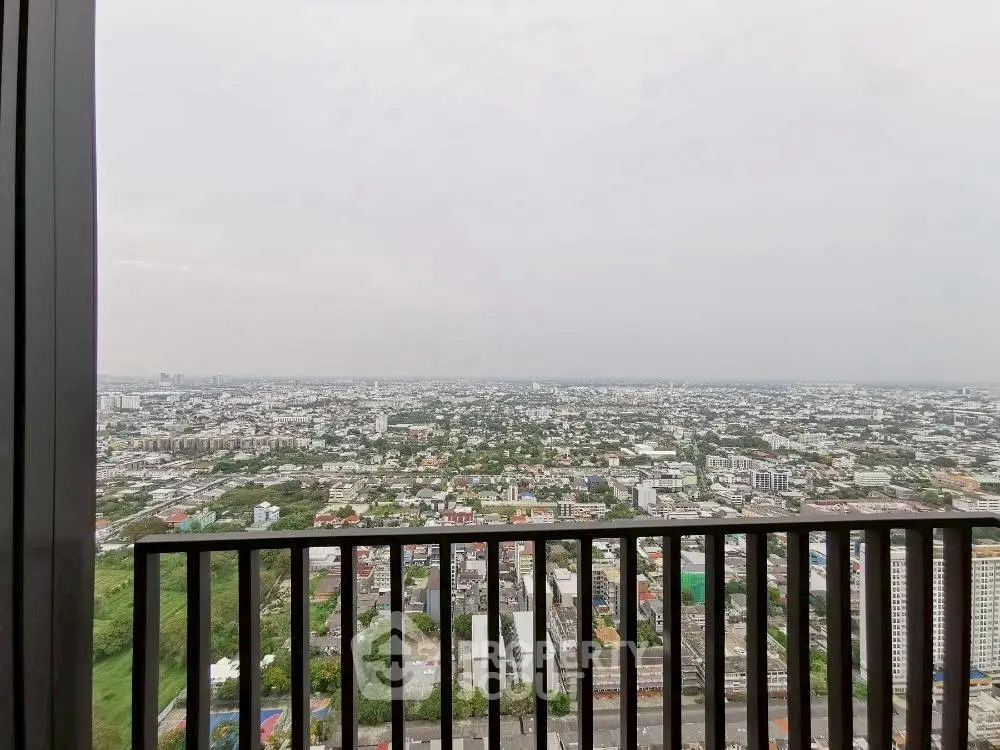 Stunning panoramic city view from high-rise balcony, perfect for urban living.