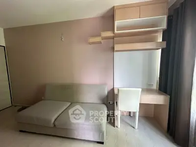 Modern living room with stylish sofa and built-in desk, perfect for urban living.