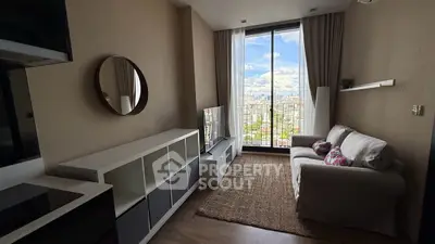 Chic living room with city view, cozy sofa, and modern decor