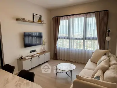 Modern living room with large window and stylish decor