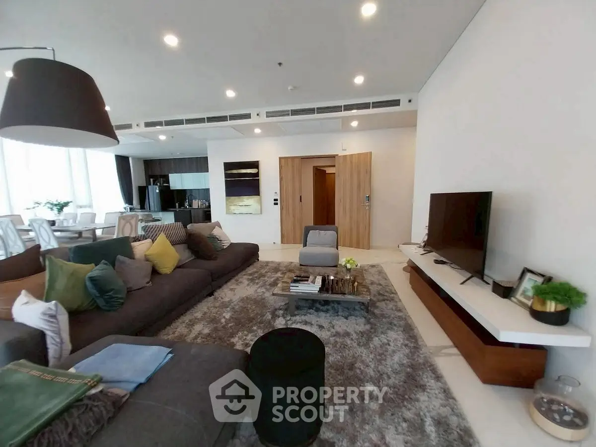 Spacious modern living room with plush sofa and stylish decor