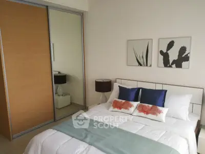 Modern bedroom with stylish decor and sliding closet doors