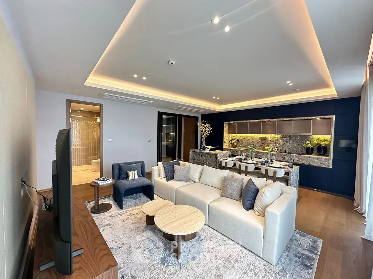 Luxurious open-plan living room with modern kitchen and elegant decor