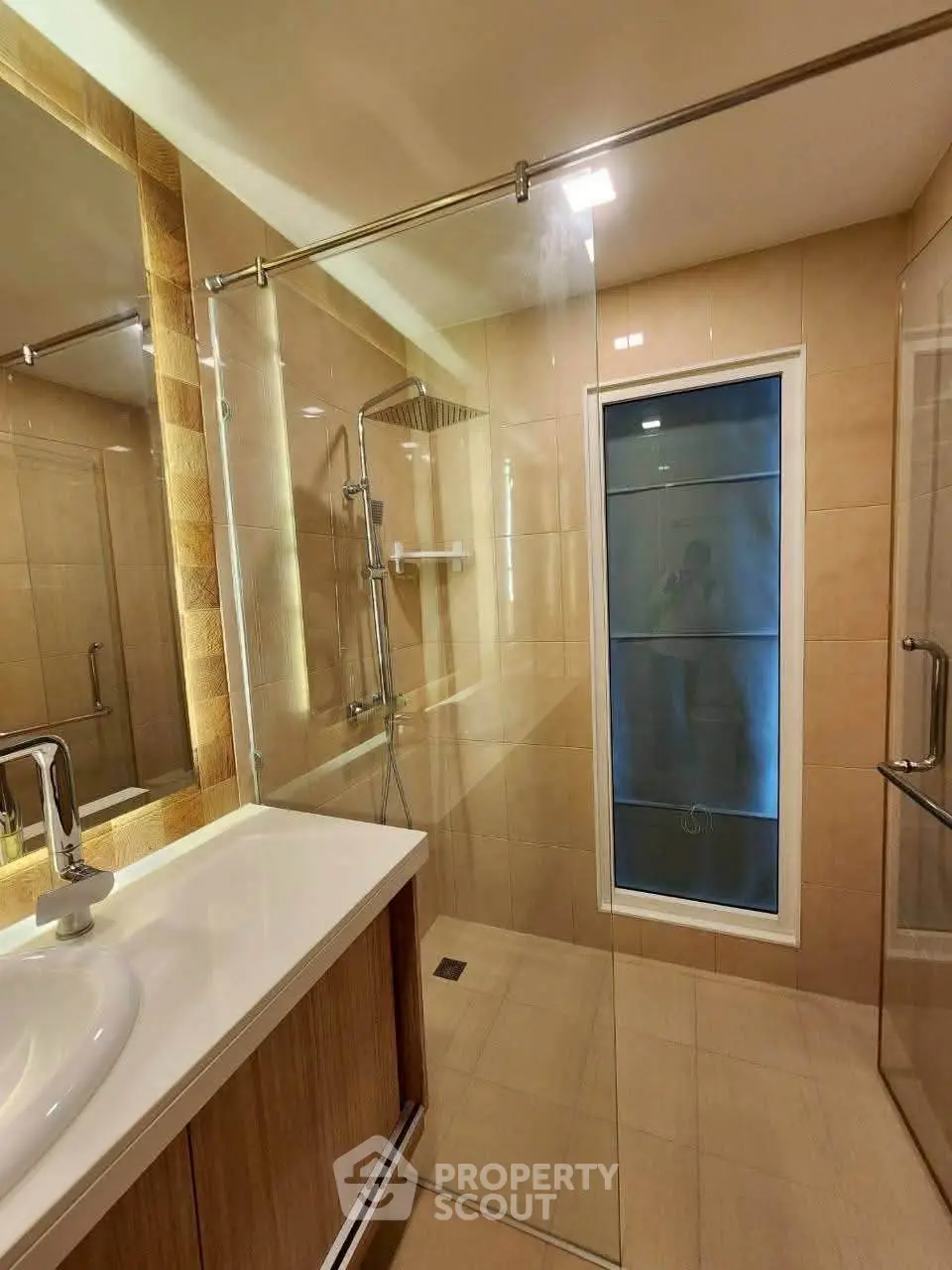 Modern bathroom with glass shower and elegant fixtures