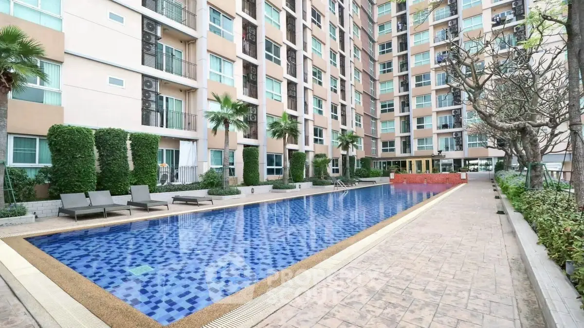 Luxurious condominium with stunning poolside view and modern amenities.