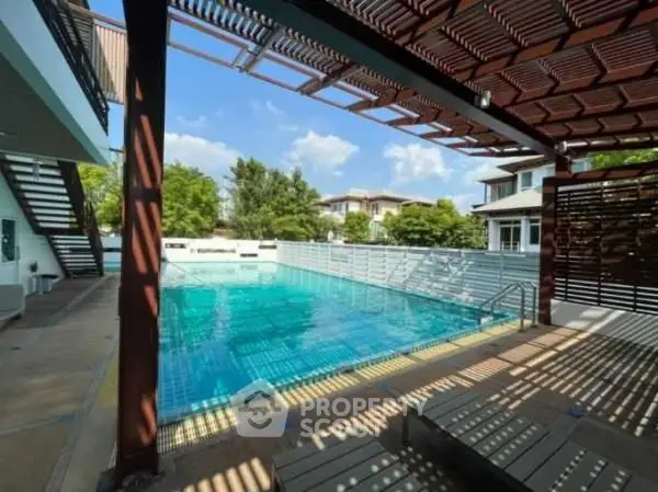 Stunning residential pool area with modern design and lush surroundings