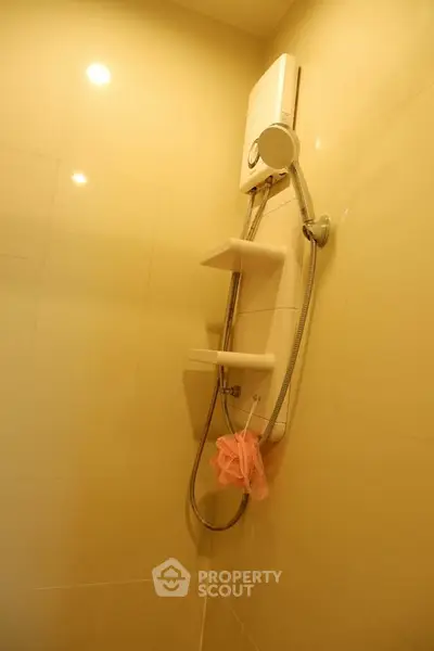 Modern bathroom with sleek shower unit and warm lighting