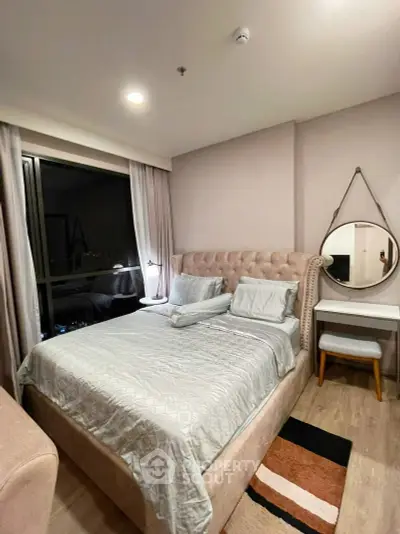 Cozy bedroom with elegant decor and large window view