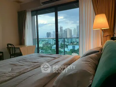 Luxurious bedroom with stunning city view and cozy ambiance