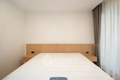 Minimalist bedroom with large window and modern design