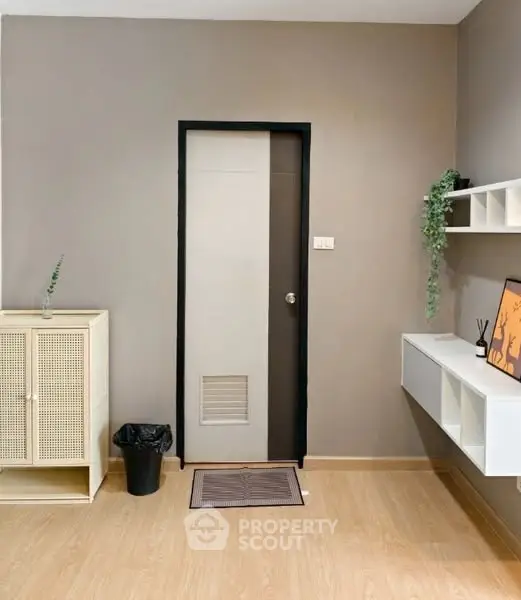 Modern minimalist room with sleek storage and decor