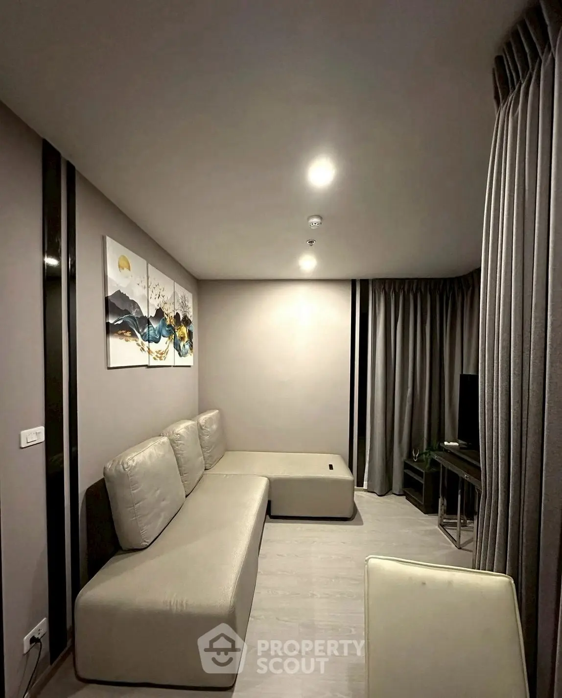 Modern living room with minimalist decor and cozy seating area