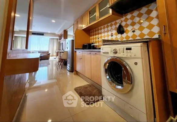 Spacious kitchen with modern appliances and open layout in a stylish apartment.